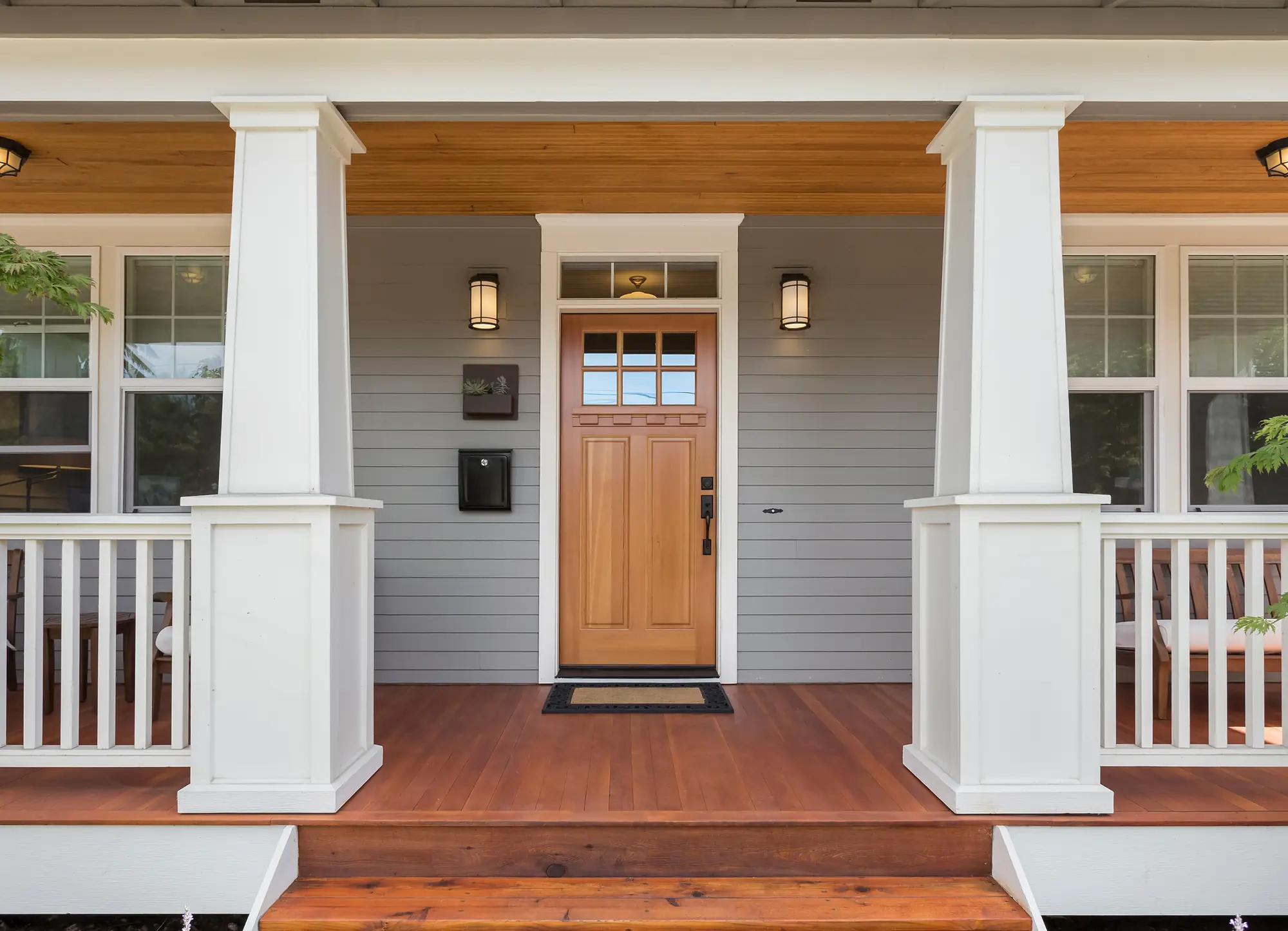 Craftsman entry door on a covered porch
