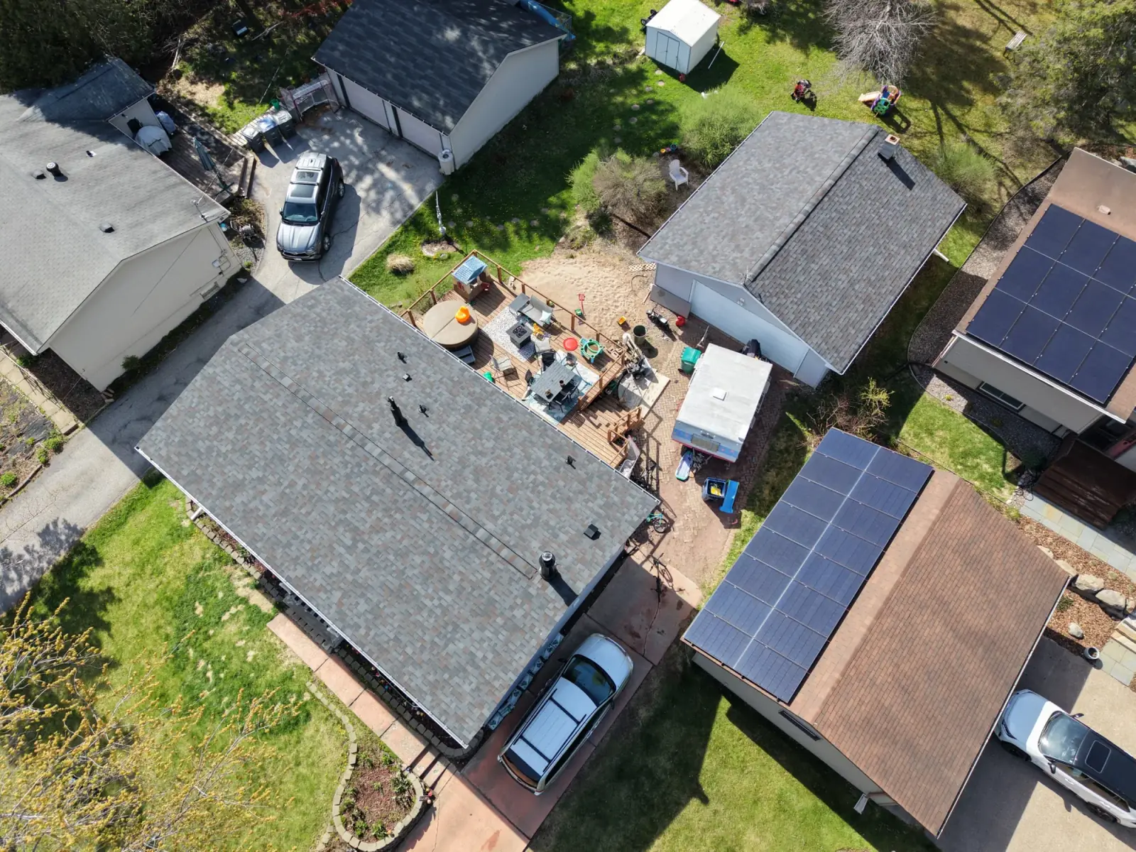 Aerial view of a completed asphalt shingle roof on a Duluth home
