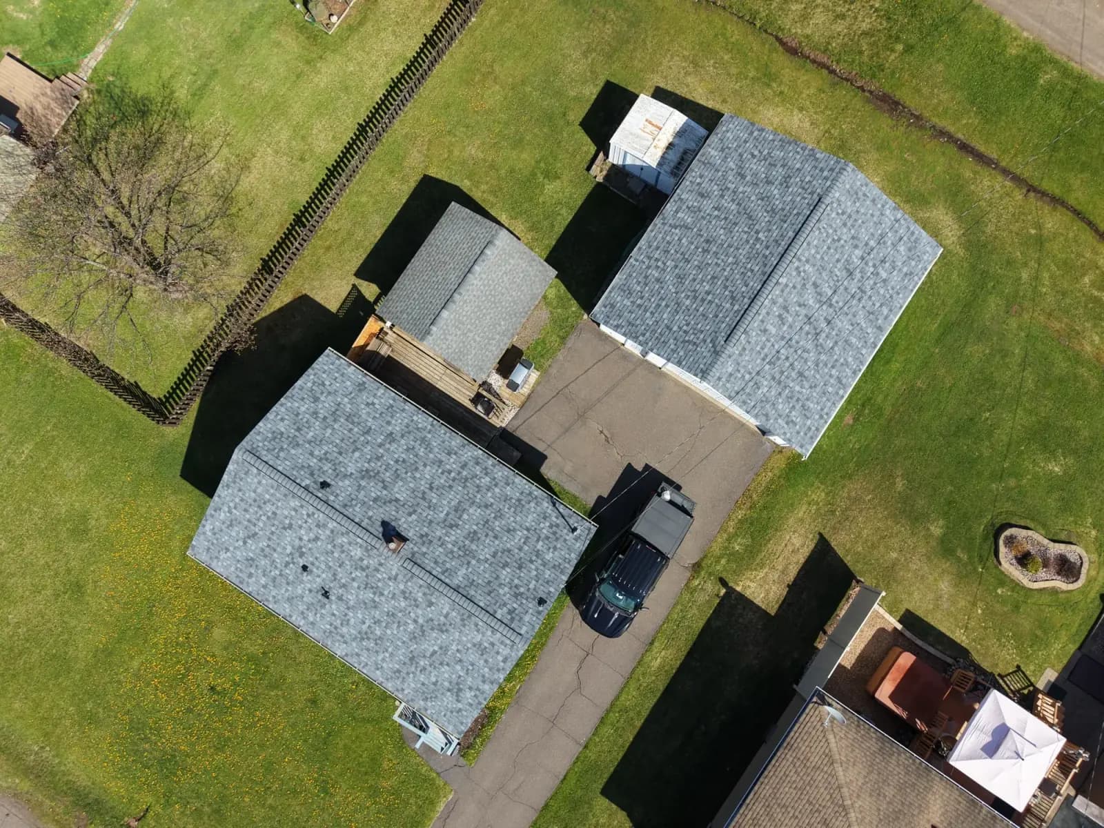 New roof on a detached garage alongside the main house in Duluth