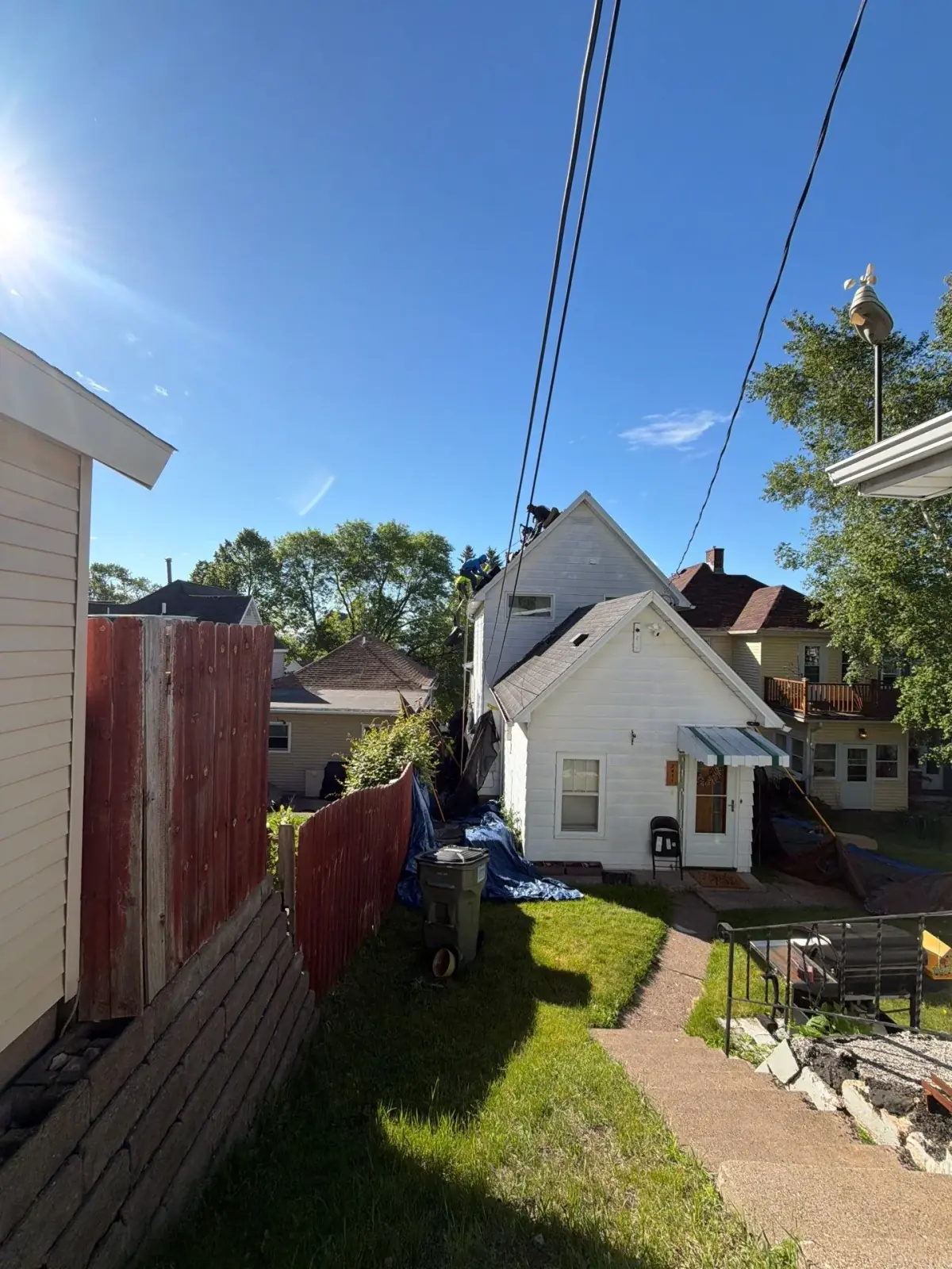 Roofing crew working on a steep-pitch roof in Duluth, Minnesota